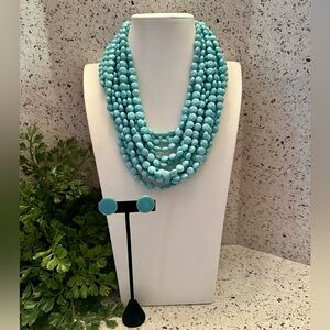 Light turquoise multi strand bead necklace and earrings